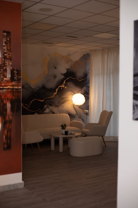Modern lounge area with abstract lightning and cloud mural
